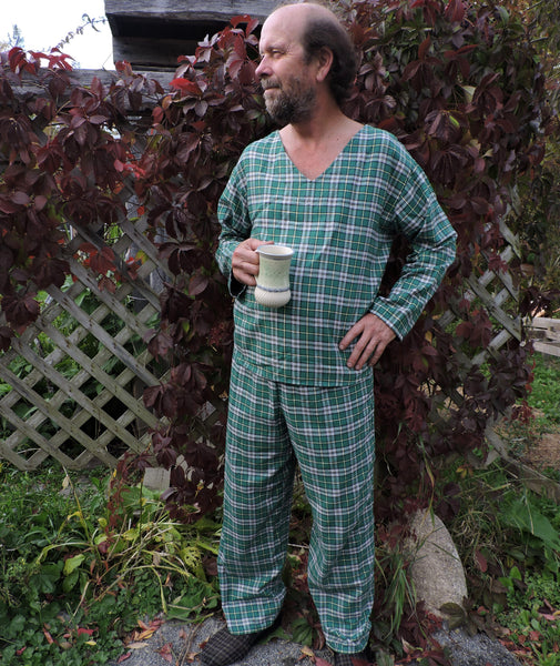 A person standing outdoors wearing a Cape Breton Tartan  pyjama set with a v-neck and shirttail hem.